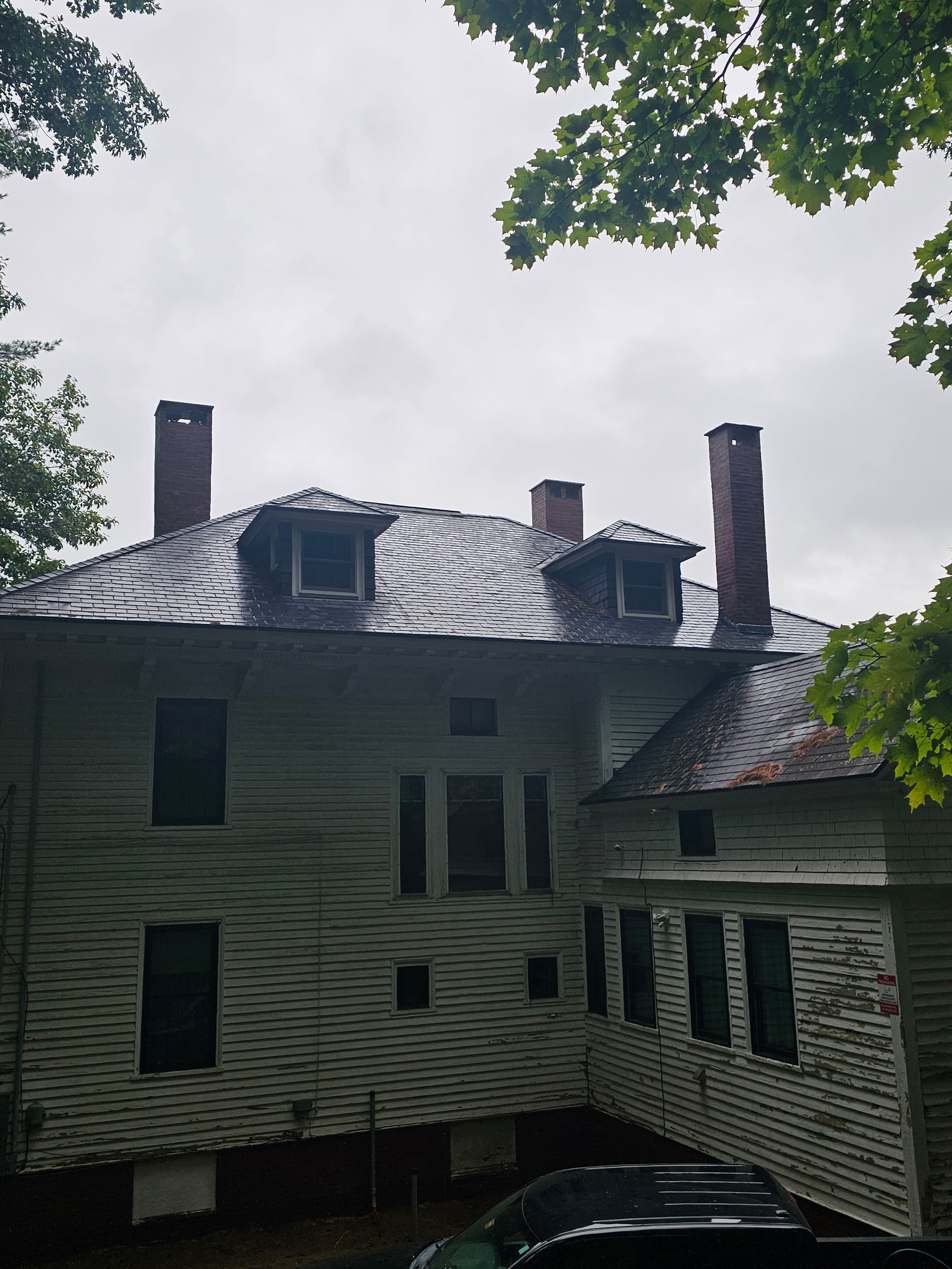 Chimney after restoration — finished chimney on slate roof
