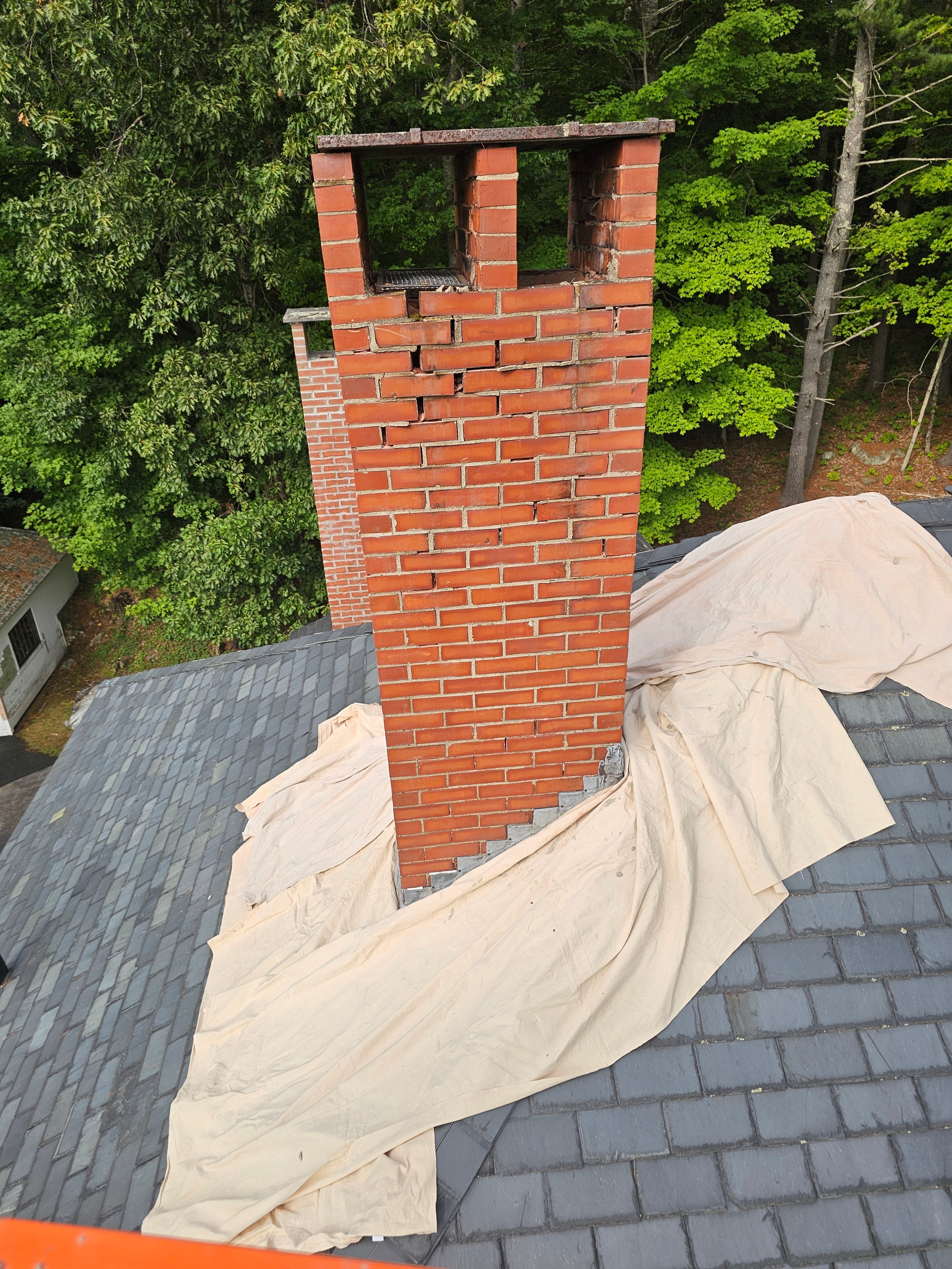 Chimney before restoration — failing mortar joints