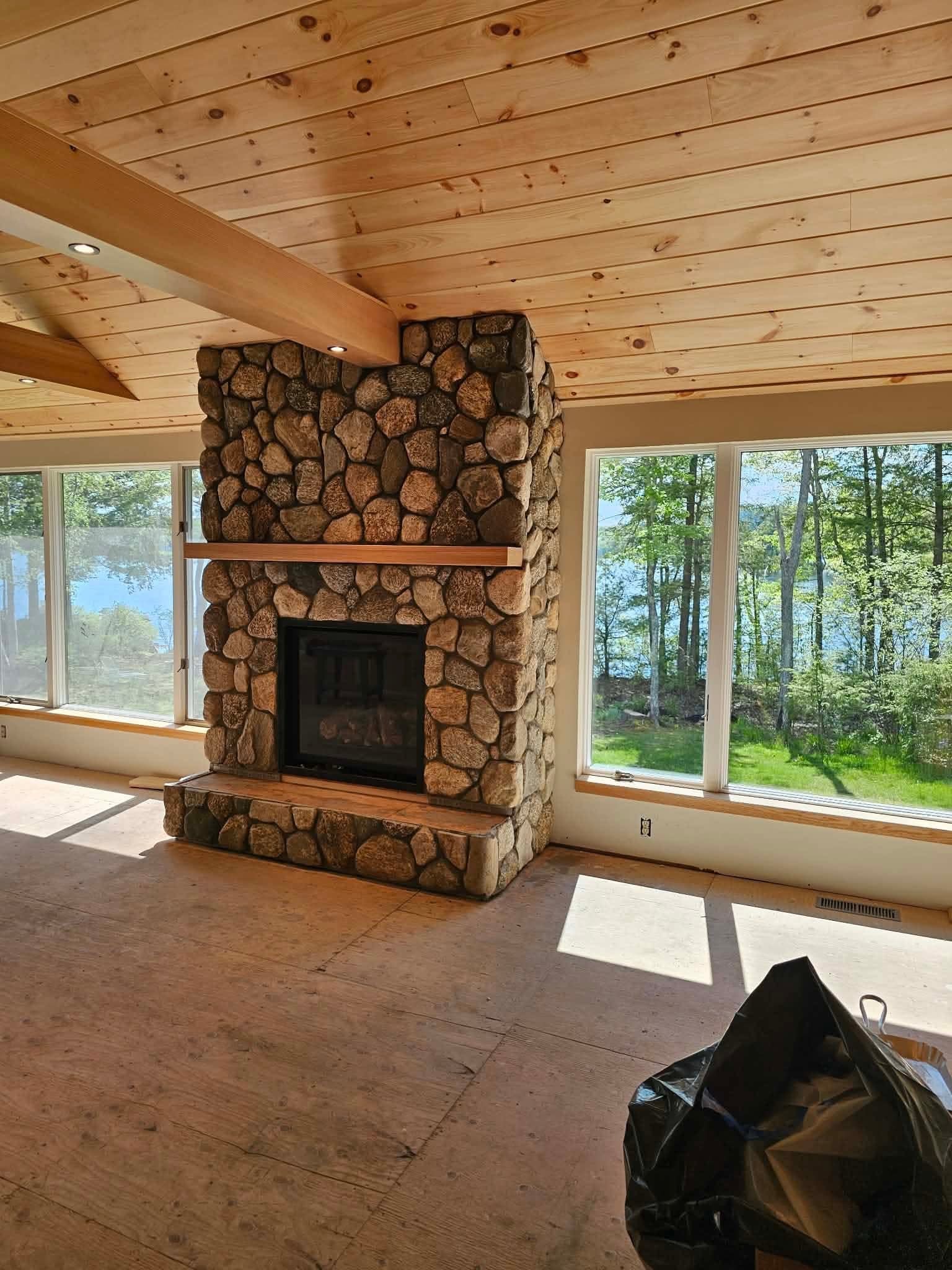 Fieldstone fireplace completed by Malone Masonry