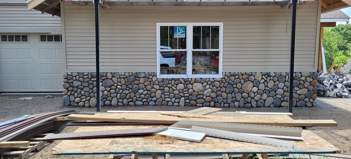 Stone fireplace completed by Malone Masonry